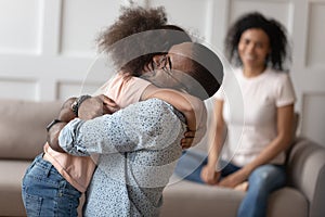 Happy little girl hug dad reunited after separation