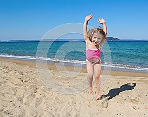 Happy little girl jumping