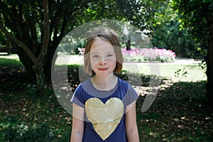 Happy little girl kid outdoors portrait