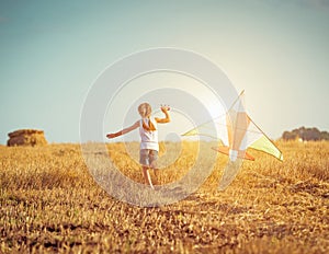 Happy little girl with a kite