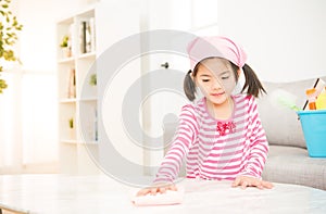 Happy little girl learning cleaning