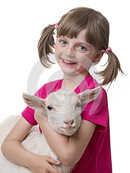 Happy little girl with little goat