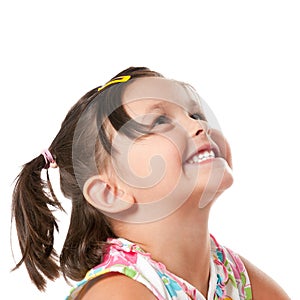 Happy little girl looking up