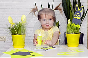 Happy little girl makes felt bunny for Easter dÃ©cor. Easter