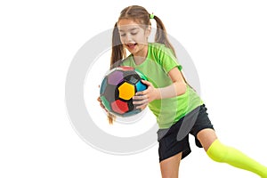 Happy little girl with multicolor soccer ball in her hands