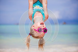Happy little girl outdoors during summer vacation have fun with father