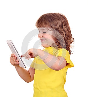 Happy little girl play with tablet pc