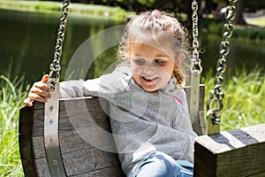 Happy Little Girl On Playground