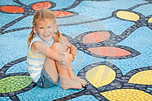 Happy little girl on the playground