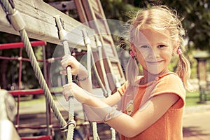 Happy little girl on the playground