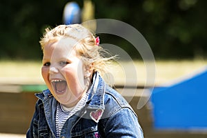 Happy little girl at playground