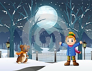 Happy little girl playing with her pet in winter night