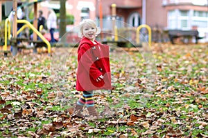 Happy little girl playing in the park