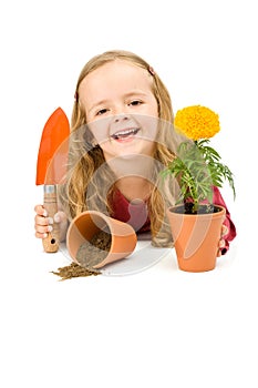 Happy little girl with potted flower