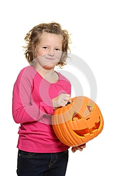 Happy little girl with pumpkin