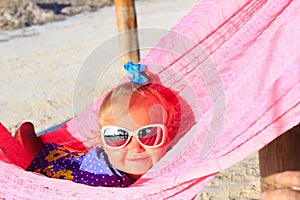 Happy little girl relaxed in hammock