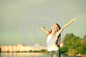 Happy Little girl standing on the beach