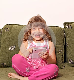 Happy little girl with tablet pc