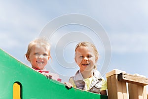 Happy little girls on children playground