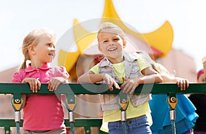 Happy little girls on children playground