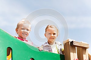 Happy little girls on children playground