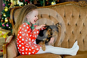 Happy Little girls and dog at Christmas