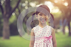 happy little girls with lollipops outdoors.