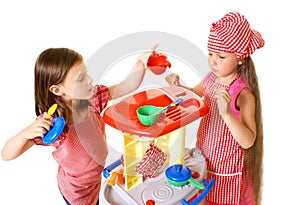 Happy little girls play cooking