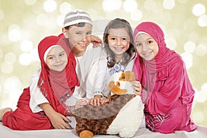 Happy little Muslim kids playing with sheep toy - celebrating Eid ul Adha - Happy Sacrifice Feast