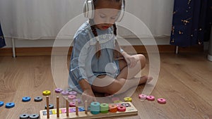 Happy Little Preschool Toothless Girl Playing With Colored Wooden Toy. Kids Learn To Count By Playing Teaches Numbers At