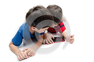 Happy little sibling boy use tablet on white background