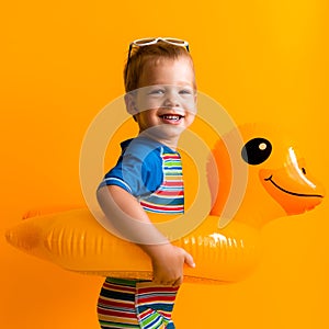 happy little smiling child swimmer sport boy wear sun glasses swimsuit, Kid Inflatable swimming ring yellow duck point