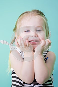 Happy little smiling girl in dress.