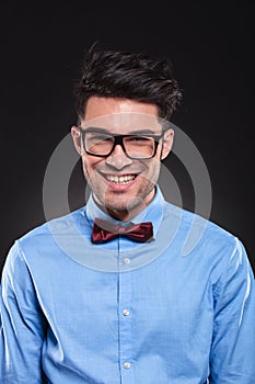 Happy looking guy wearing glasses and suit while smiling