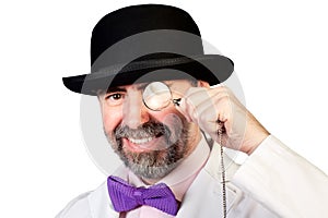 Man with a monocle in his hand photo