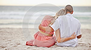 Happy, love and couple on a beach hug watching the sunset, beach waves and sea together. Happy boyfriend and girlfriend