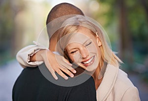 Happy, love and couple in park hug for bonding, relationship and love outdoors for date. Nature, dating and man and