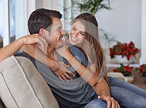 Happy, love and couple relaxing on sofa for bonding in living room at apartment together. Smile, resting and young man