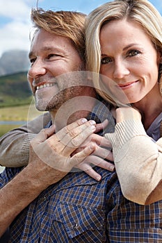 Happy, love and portrait of couple at countryside in spring for bonding, adventure and holiday together. Man, woman and