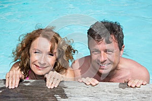 Happy and lovely couple in private swimming pool