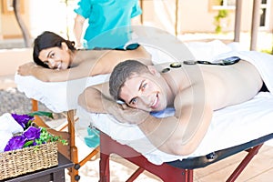 Happy Lovers Enjoying Remedial Treatment In Vacation photo