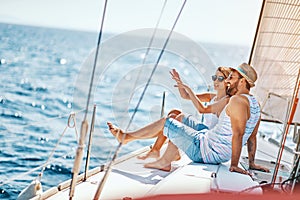 Happy lovers relaxing on a luxury yacht. couple on cruise