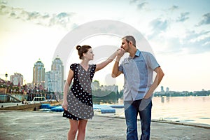 Happy lovestory concept. man kissing girl hand photo