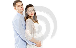Happy Loving Couple Awaiting The Birth Of Child Posing On A White Background photo