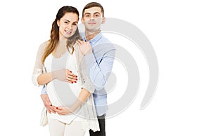 Happy Loving Couple Awaiting The Birth Of Child Posing On A White Background photo