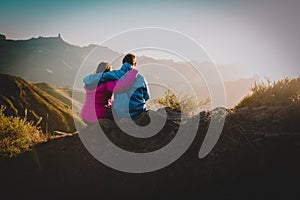 Happy loving couple hiking in mountains, family travel in nature