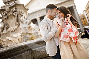 Happy loving couple, man and woman traveling on holidays in Rome