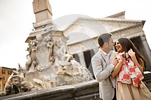 Happy loving couple, man and woman traveling on holidays in Rome