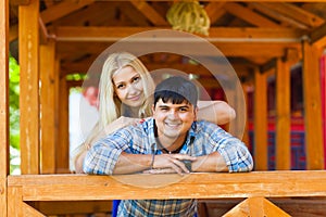 Happy loving couple. Portrait of beautiful young couple bonding to each other and smiling while both standing outdoors