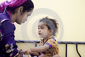 Happy loving family. asian mother and baby boy, hindu